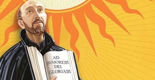 An image of a man holding a book in front of the sun, reflecting on Jesuit Spirituality.