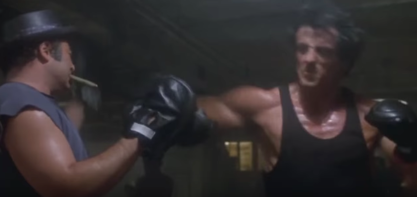 Rocky hitting pad in his movie.