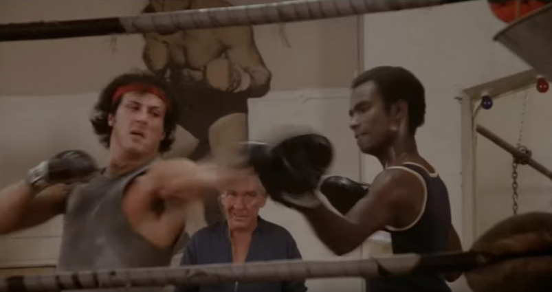 Rocky hitting the pads while training.