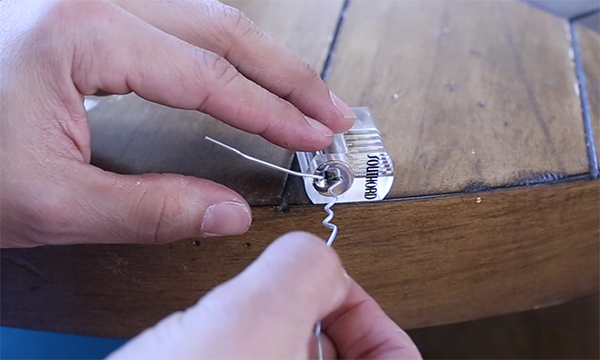 Opening lock through paper clip.