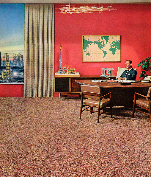 Businessman sitting on chair in his office. 