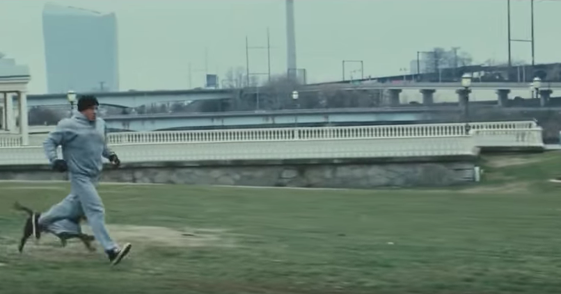 Rocky running with his dog.