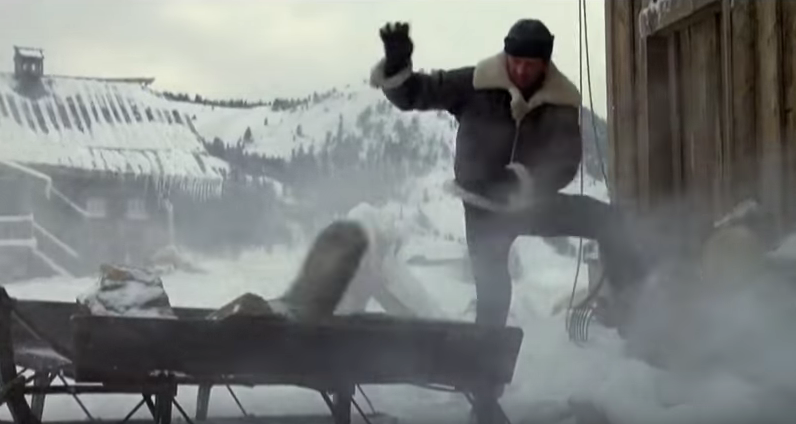 Rocky tossing rocks in snow.