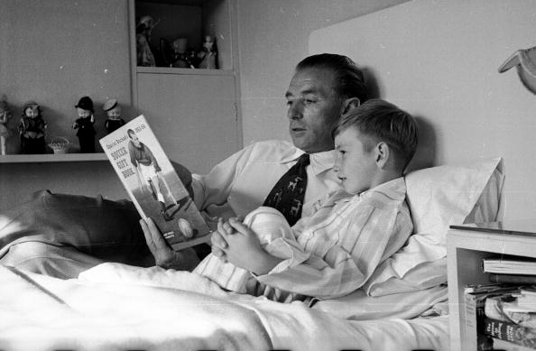 Vintage father telling story to his son.