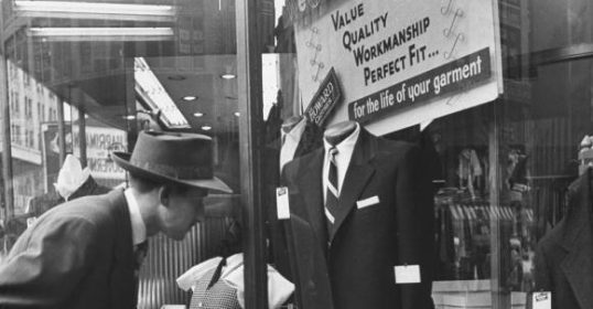 A man looking at a window.