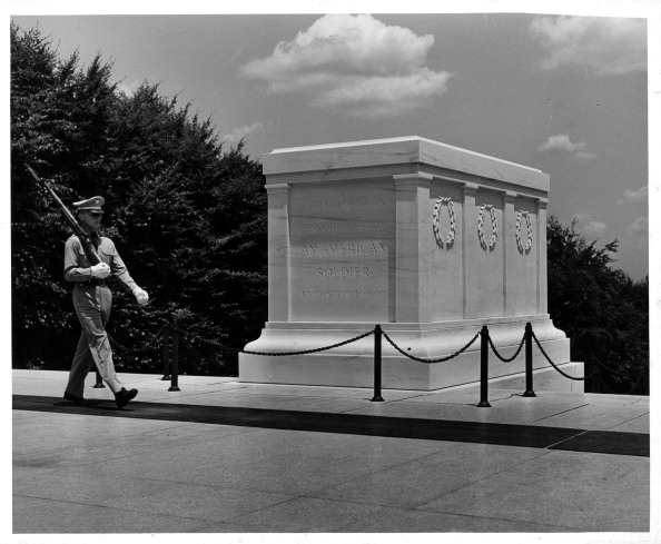 Guard marching with tomb of the unknown soldier.