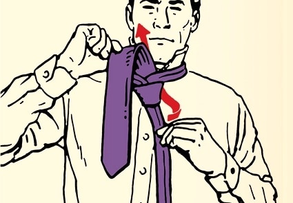 A person in the process of learning how to tie a simple necktie knot.