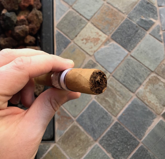 After removing the cap of cigar. 