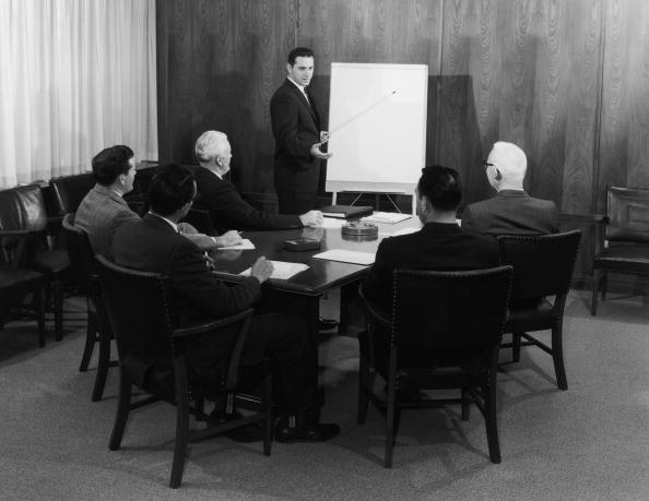 Vintage businessman leading a meeting.