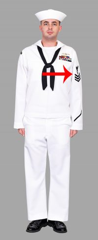 Solider wearing white uniform with patch on the upper left sleeve.