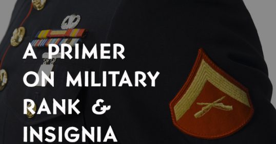 A close up of a military uniform with insignia.