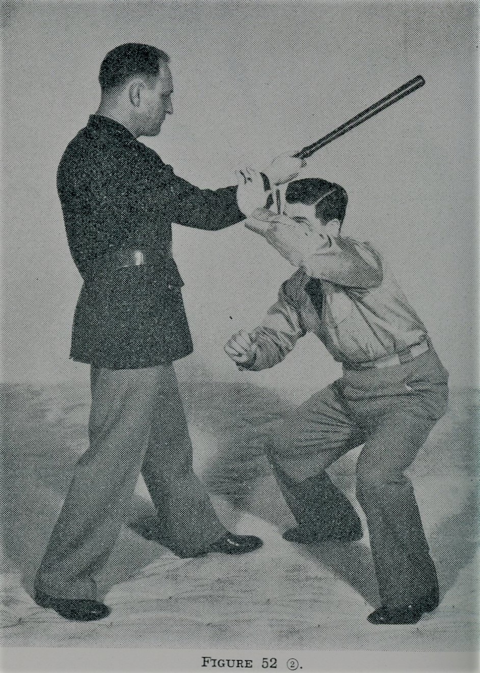 Lowering head to avoid the stroke of club while self defense.