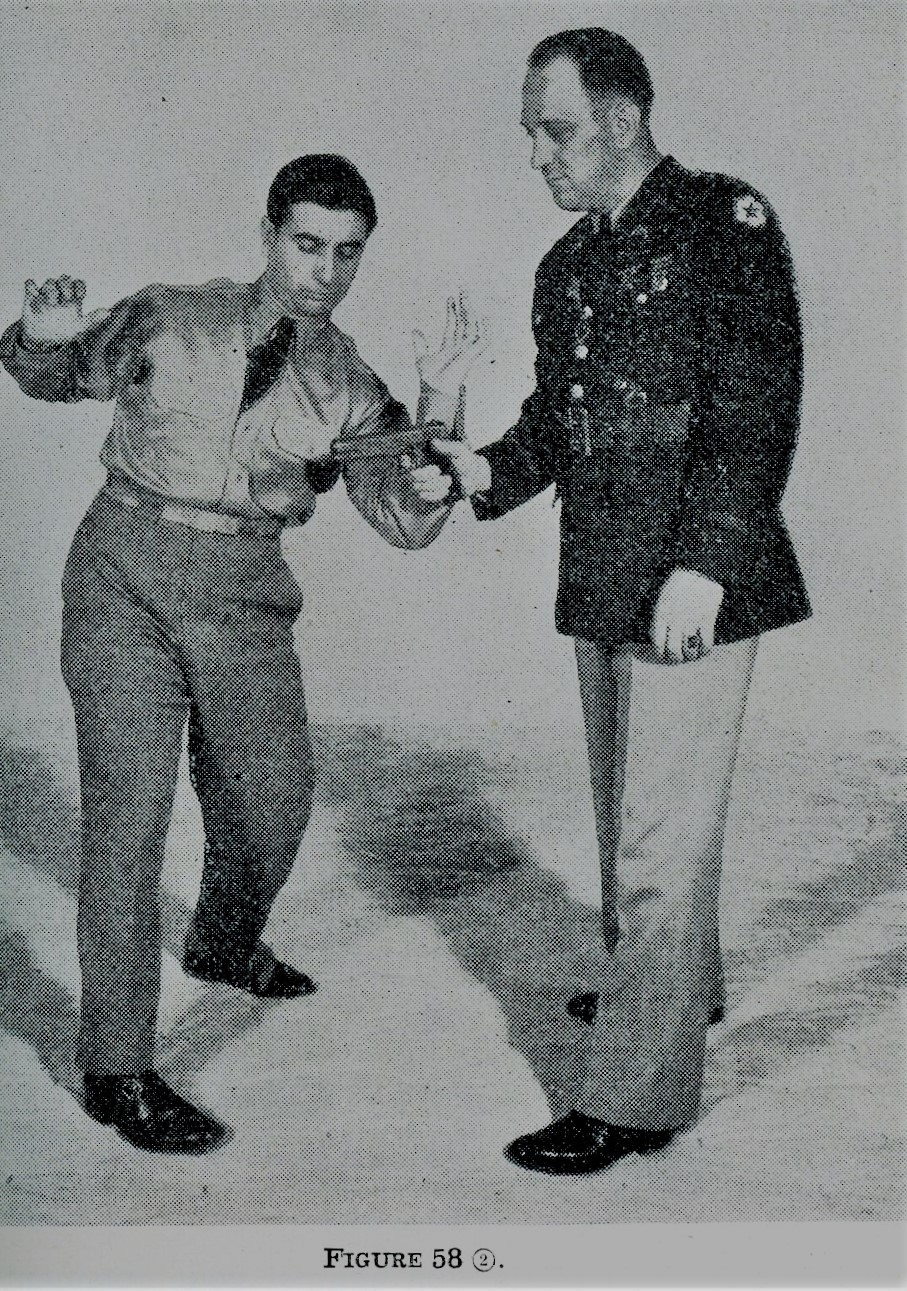 Striking opponent's hand holding gun during self defense.