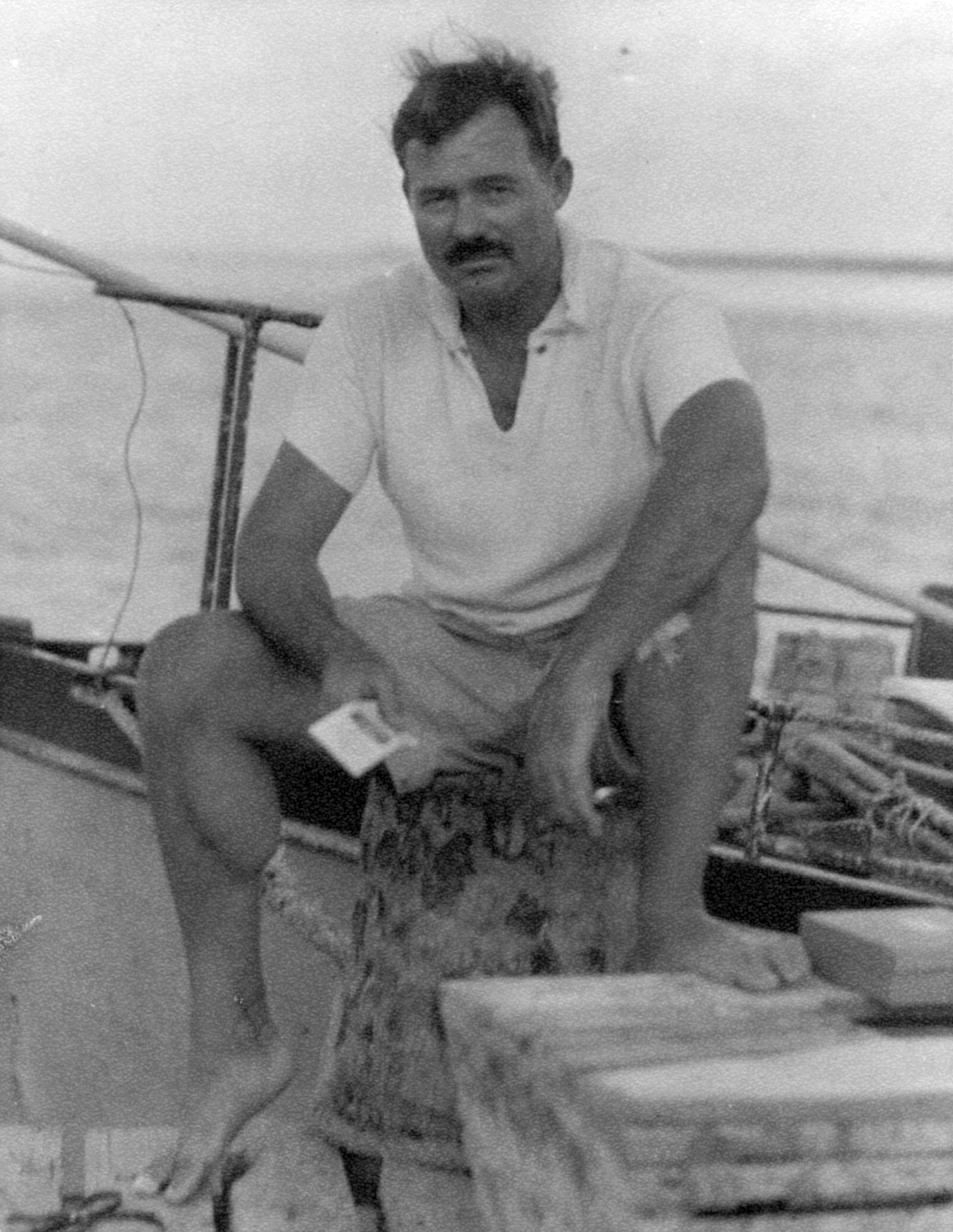 Vintage man sitting on a boat.