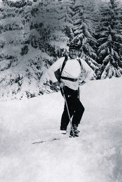 Hemingway standing in the snow.