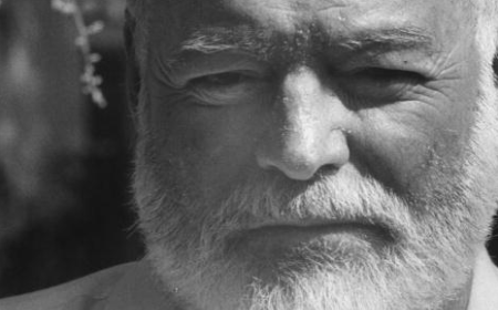 A black and white photo of a man with a beard that resembles Ernest Hemingway.