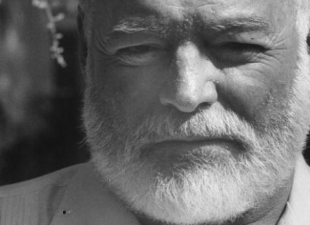A black and white photo of a man with a beard that resembles Ernest Hemingway.