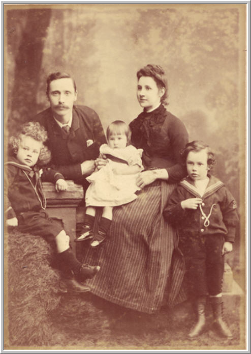 Vintage family portrait of a couple having two sons and a daughter.