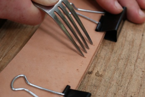 Spacing a leather with fork.