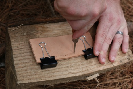 Creating holes in a leather.