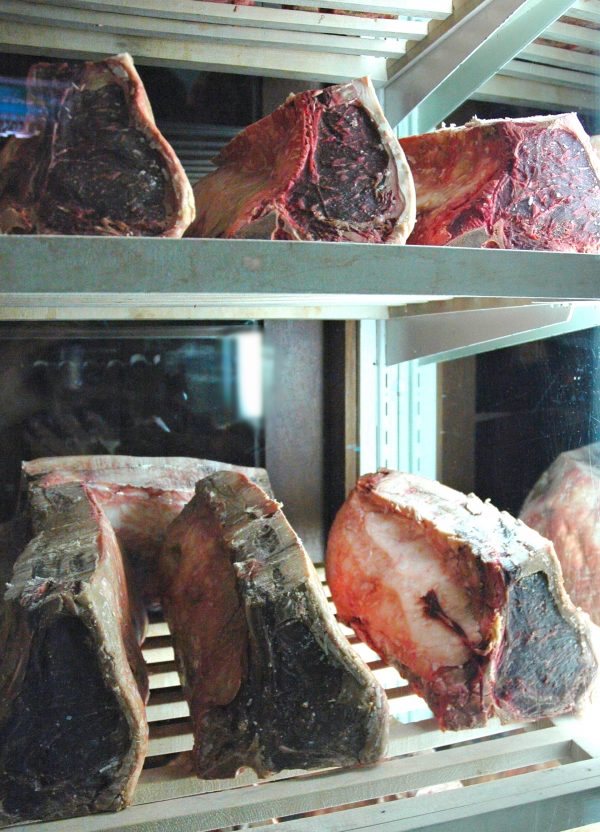 Dry-aged beef in drying chamber.