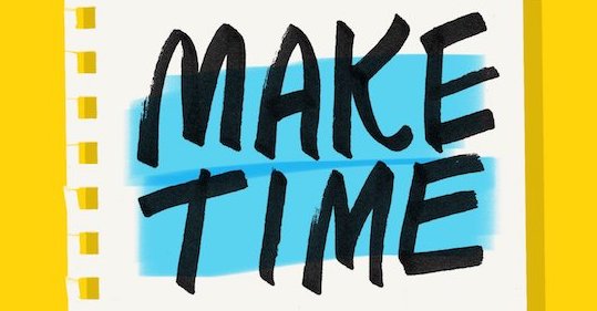 A notebook with the words "make time" written on it.