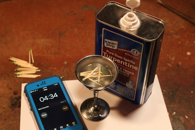 Matches poured in turpentine and a phone is placed with it.