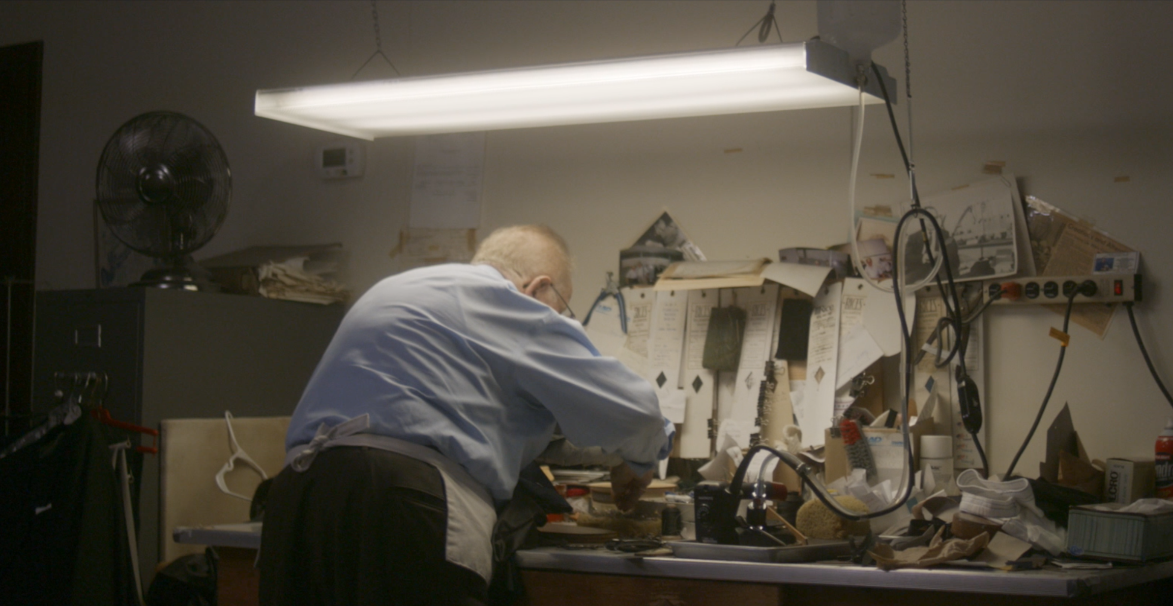 A man working in a craft workshop.