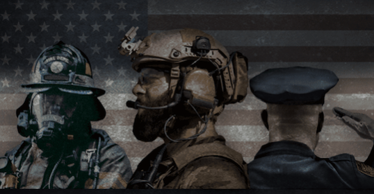 A group of firefighters stand proudly in front of an American flag.