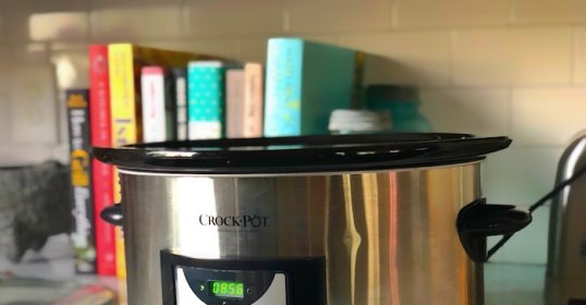 A crockpot on the countertop is perfect for slow-cooking delicious meals.