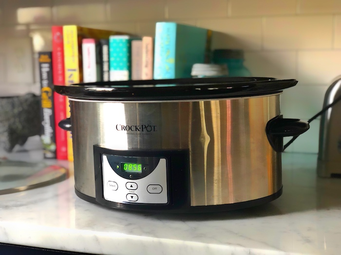 A crockpot on the countertop is perfect for slow-cooking delicious meals.