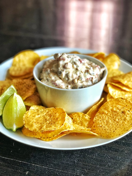 Loaded queso in a bowl.