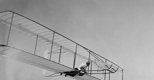 A man in a plane flying through the air with discipline and motivation.