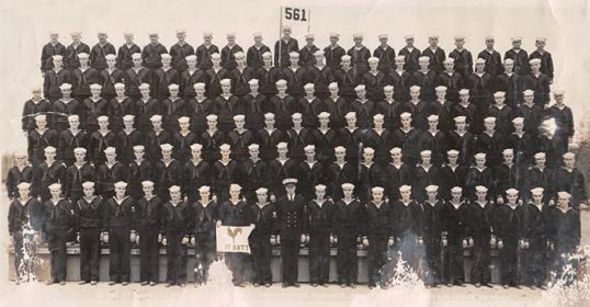 An old photo of a group of men in uniform, possibly from the Bluejacket's manual.