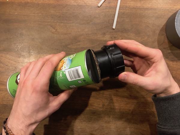 Screwing the bottom half in a can.