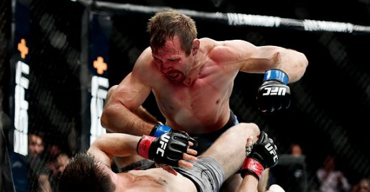 Two fighters are battling it out in the heart of the ring.