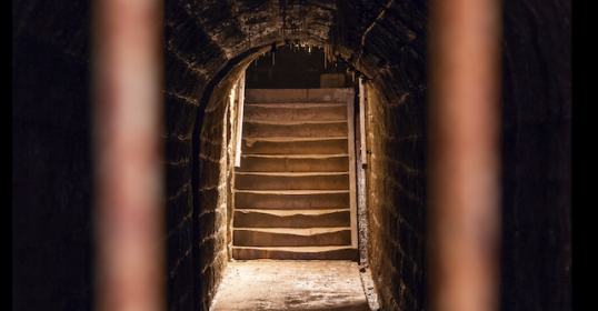 A stairway leading into a dark tunnel, perfect for a podcast exploring soul.