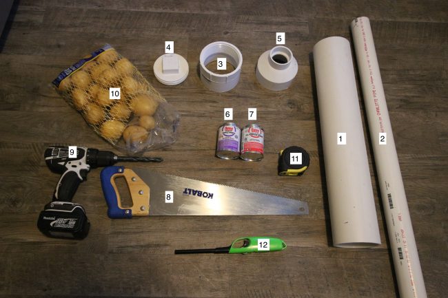 Two pvc pipes, threaded couplet, clean out cap, adapter, primer, cement, Saw , drill bit , potatoes, tape measure, stick lighter, hairspray displayed.