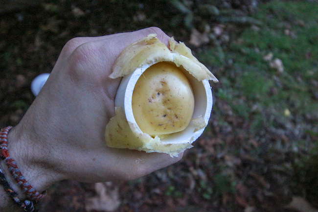 Jamming a potato into the barrel of the cannon.