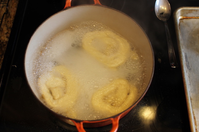 Boiling the pretzels.