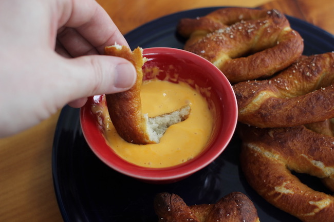 Pretzels served with warm cheese.