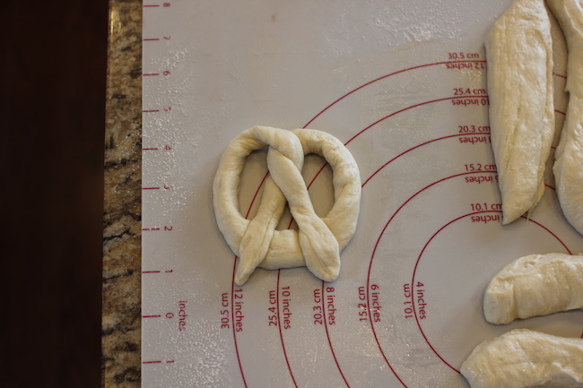 Dough transformed into classic pretzel shape.