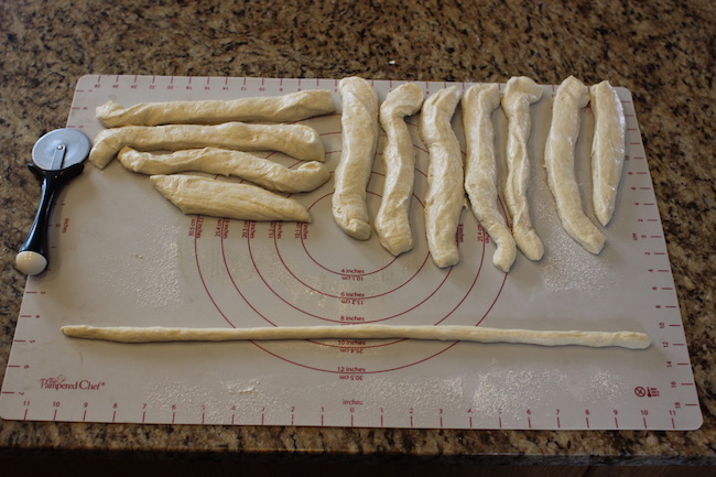 Forming Dough "Ropes" Into pretzels.