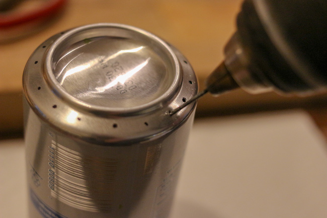 Drilling holes in can.