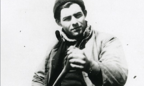 A classic photo of a man with a gun.