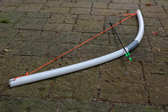 Bow and an Arrow placed on ground.