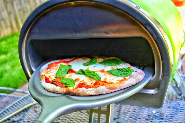 Pizza making it to the oven.