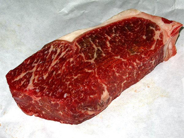 Boneless strip uncooked steak.