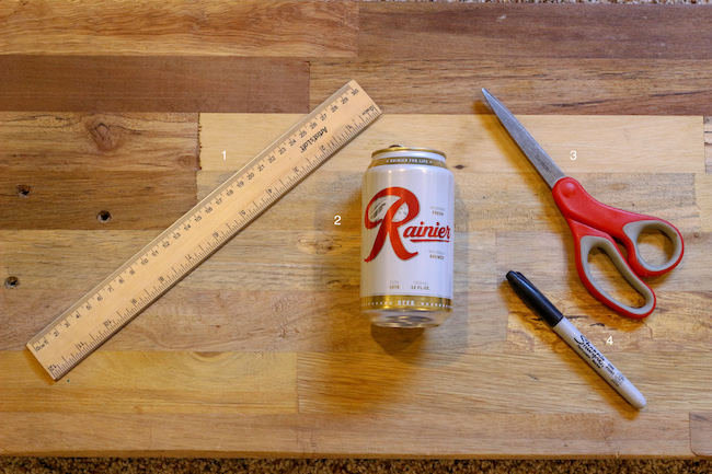 Supplies used to make soda can whistle.