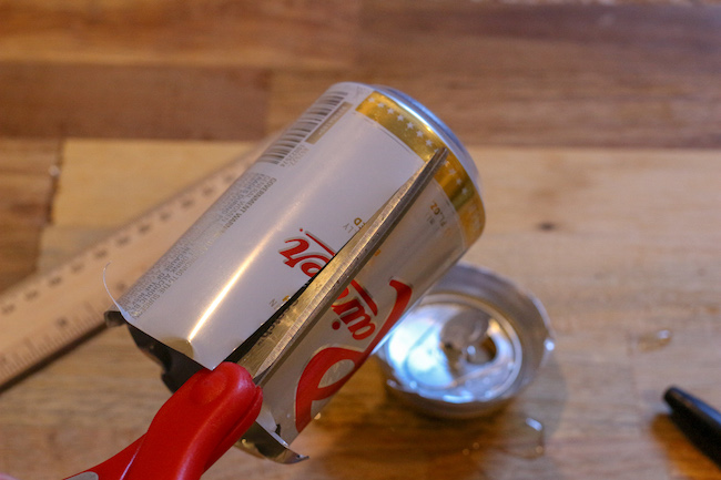 Cutting of a soda can from a top.